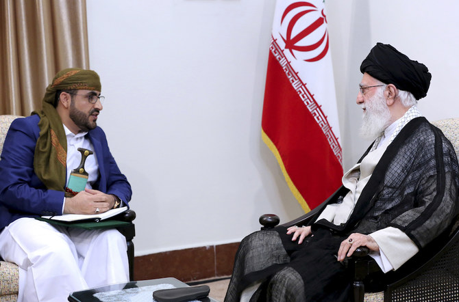 Khomeini with a Houthi leader
