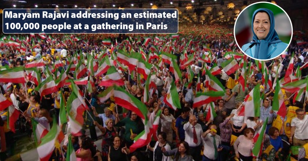 Maryam Rajavi addressing an estimated 100,000 people at a gathering in Paris