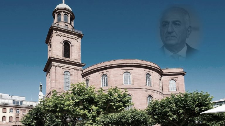 Editorial photo illustration of Reza Pahlavi and Frankfurt’s Paulskirche amid controversy over Germany’s 2026 Freedom Prize.